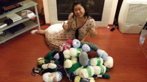 Elaine in a sea of donated yarn  – happy knitting!